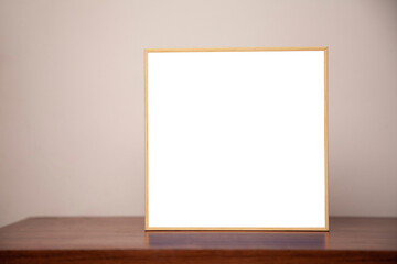 A painting on a bench on a wooden table. Frame concept. Memory concept. .Space for text.