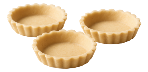 Vibrant orange carrot puree swirled on a dark stoneware plate with microgreens scattered on top.