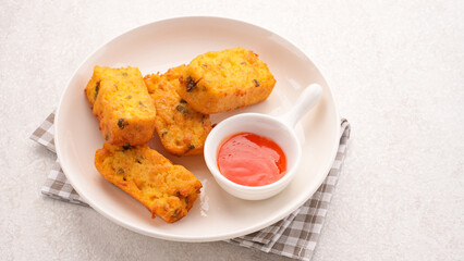 Homemade tofu nuggets served with chilli sauce
