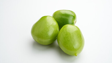 Fresh green tomatoes isolated on white background
