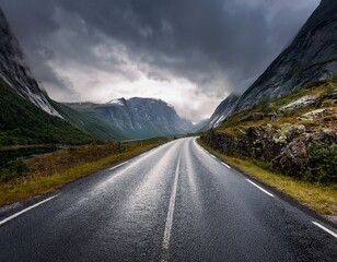 Naklejka premium empty road in a moody norway mountain landscape