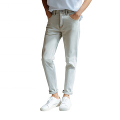 Naklejka premium Young adult wearing casual outfit, standing confidently with hands in pockets. The outfit includes light jeans and white sneakers on a white isolated background.