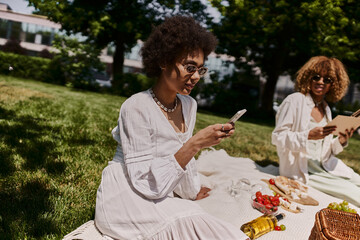Joyful summer picnic with best friends under the sun in a lively park