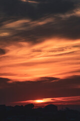 Soft evening light over city silhouettes and colorful sky