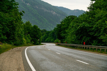 mountain road in the Caucasus to Arkhyz among the mountains in the clouds before rain