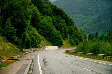 mountain road in the Caucasus to Arkhyz among the mountains in the clouds before rain