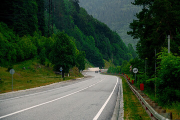 mountain road in the Caucasus to Arkhyz among the mountains in the clouds before rain