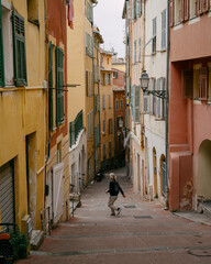Charming Mediterranean Alley With Vibrant Pastel Buildings and Cobblestone Steps