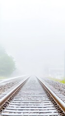 Fototapeta premium Misty Railway Tracks Disappearing into the Fog: A Serene and Mysterious Journey Along Vanishing Train Lines in Atmospheric Rural Landscape