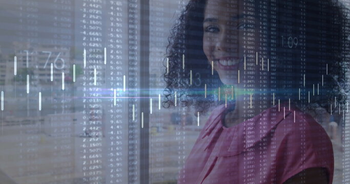 Smiling businesswoman standing before glass partition at modern office, with financial data overlay