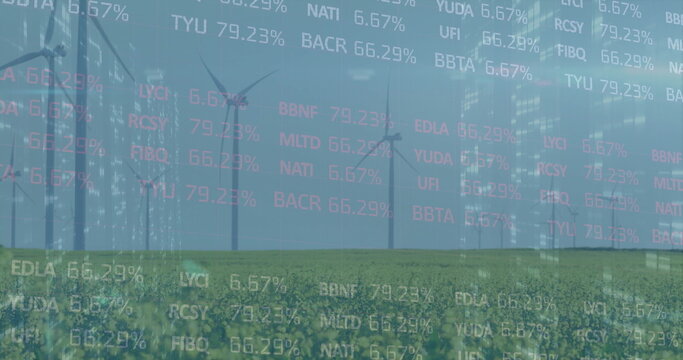 Rotating wind turbines generating energy on rural wind farm, with overlaid financial data
