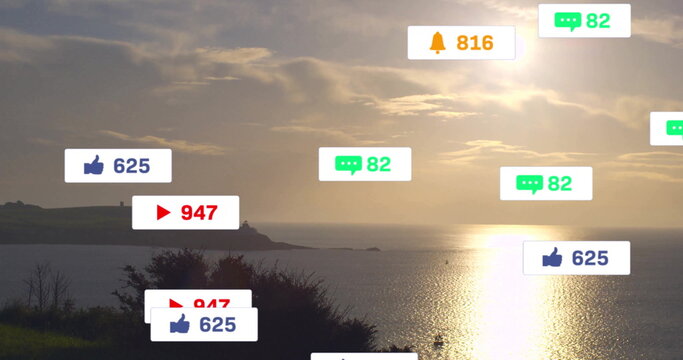 Fototapeta Showing sea reflecting sunlight at coast, with floating reaction icons showing 625, 947, 82 and 816