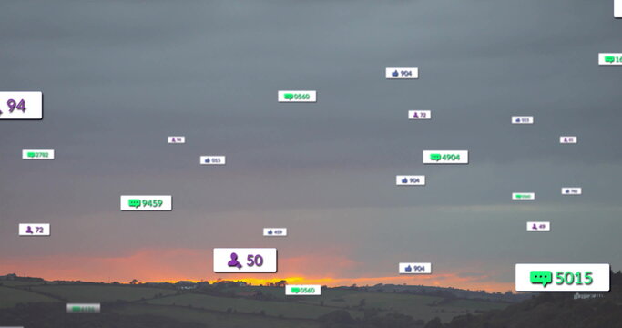 Fototapeta Drifting notification icons over hills at dusk, with green chat, purple user, blue thumbs-up icons