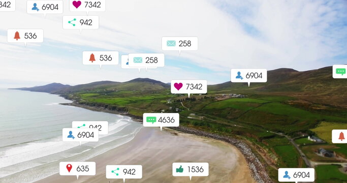 Fototapeta Floating translucent social media notification icons above bay flanked by green hills and fields