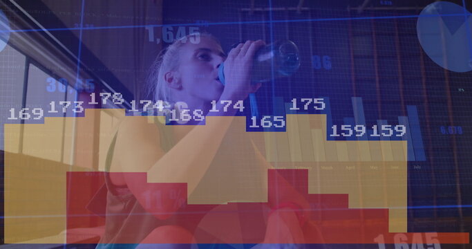 Pausing midworkout, athlete drinking from sport water bottle on studio bench, with data charts - Powered by Adobe
