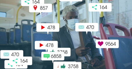 Inspecting smartphone commuter wearing suit and mask viewing social media icons inside bus, metrics