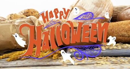 Fototapeta premium Decorating Happy Halloween graphic overlaying wood table, with baguettes paper bag and wheat grains