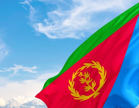 Eritrean flag waving against a blue sky