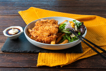 Crispy Fried Chicken Dish Served on a Rustic Table