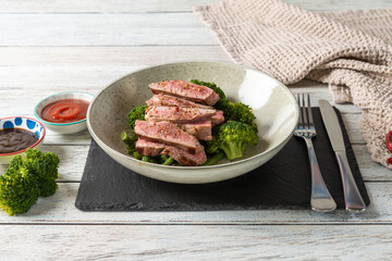Enjoying Steak With Steamed Veggies