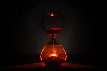 artistic glowing hourglass like sunrise or sunset, symbolizing time and creativity. Vibrant...