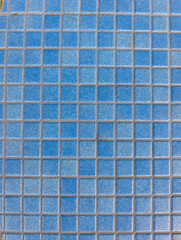 Blue mosaic tiles forming geometric pattern on floor in lignano sabbiadoro
