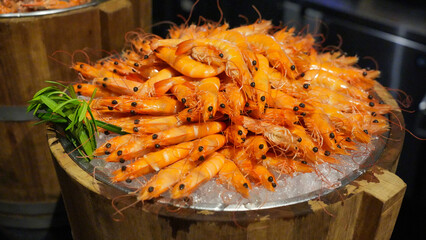 Delicious grilled shrimp dishes, healthy and tasty meat dishes arranged beautifully on ice buckets.