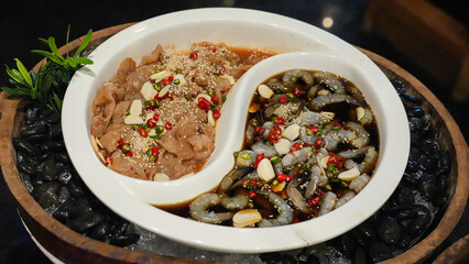 Pickled shrimp and salmon are beautifully arranged on a plate in a wooden bucket.