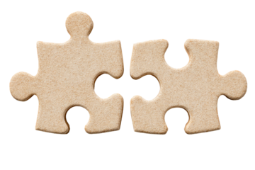 Two light beige puzzle pieces, slightly textured, joined together