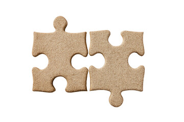 Two light beige puzzle pieces, closely joined, on a black background