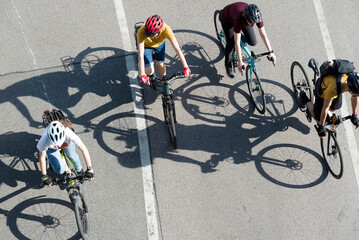 People cycling in the city, top view
