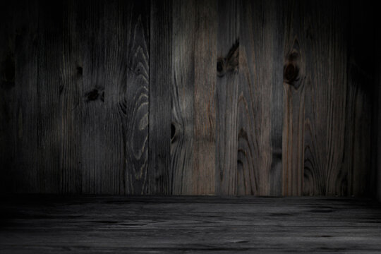 Wooden background for product presentation. Empty wooden table, wall with boards. Selective focus.
