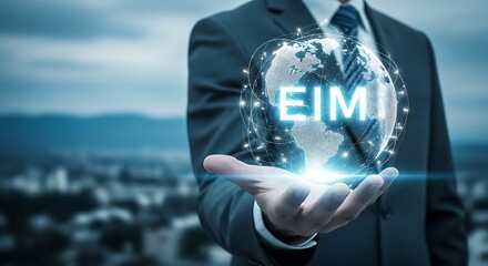 Enterprise information management concept with a businessman holding a glowing globe with eim text in the center, symbolizing global data strategy and digital transformation