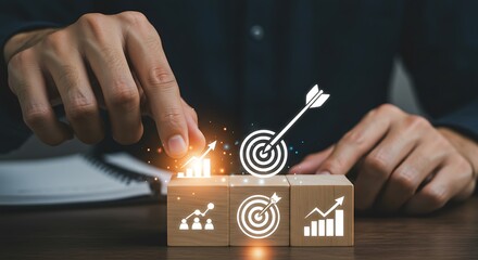 Hand putting virtual target board and arrow which print screen on wooden cube. Business achievement goal and objective target concept.