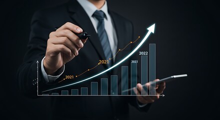 Businessman draws increase arrow graph corporate future growth year 2021 to 2022 for business performance improvement