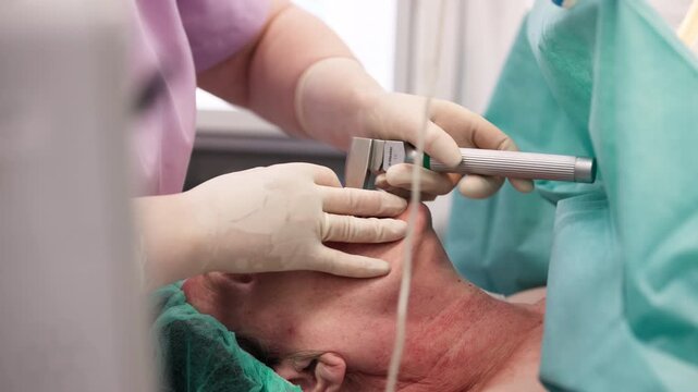 Close-up of an endotracheal tube being inserted into a patient. Concept ensuring airway management and ventilation during surgery.