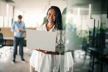Portrait of a beautiful successful young business people software engineer with laptop in the office
