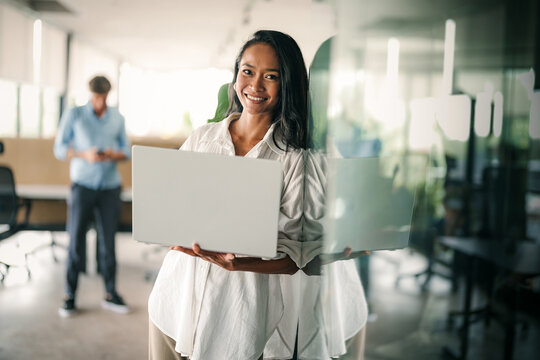 Portrait of a beautiful successful young business people software engineer with laptop in the office