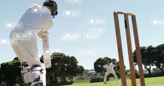 Holding bat preparing to hit ball in white uniform at cricket ground, social icons, copy space