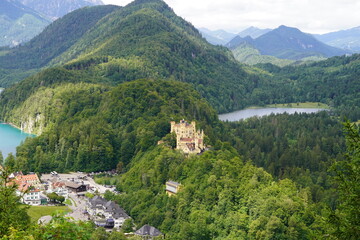 The yellow castle Hohenschwangau Castle nestled in the Bavarian forest