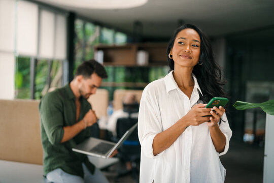 Smiling asian successful business woman, freelancer, coworker female leader using digital device