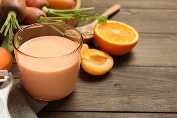 Superfood. Tasty smoothie in glass and ingredients on wooden table, closeup