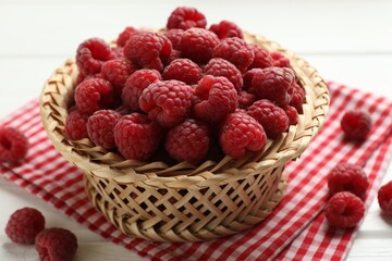Tasty fresh ripe raspberries on white wooden table, closeup