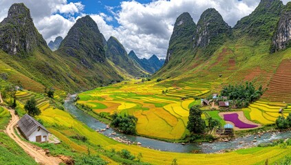 Panoramic valley with terraced rice paddies, winding river, and dramatic mountain peaks