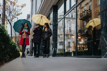 Three friends stroll together on a rainy day, carrying vibrant umbrellas and enjoying the urban...
