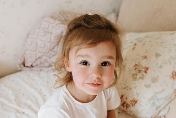 portrait of a cute, disheveled girl in the morning