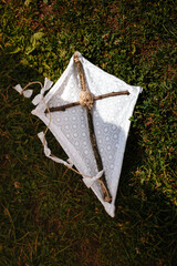 kite on green grass and religious symbol