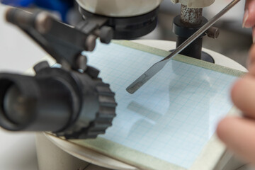 Close up detail of a scientist working with substances in a laboratory.