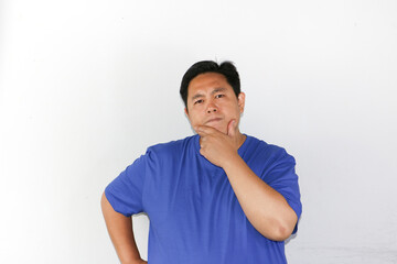 Fototapeta premium Curious expression young guy, hand hold his chin