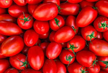 Fresh, Juicy Red Roma Tomatoes Piled Together. High-Resolution Image Perfect for Wallpapers, Digital Marketing, Social Media, and Culinary Projects